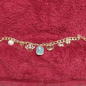 Gold Charm Bracelet with Blue Gemstone And Other Charms